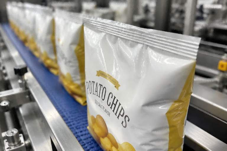 Food packaging seal integrity testing on conveyor